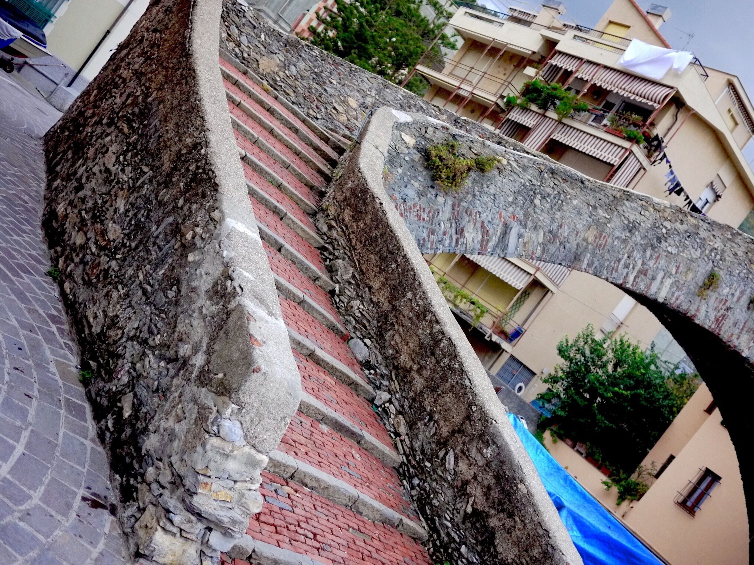 This is a Roman bridge which fords a small stream that empties into the bay.  That's right, a Roman bridge, which means that it has been standing for something like two thousand years.  You will be thunderstruck by how casually and randomly things like this appear in the middle of nowhere in Italy.  

Bogliasco isn't "nowhere," mind you.  It's a suburb of Genoa.  But the idea that a little bridge like this could have stuck around for so long practically defies comprehension.

#beach