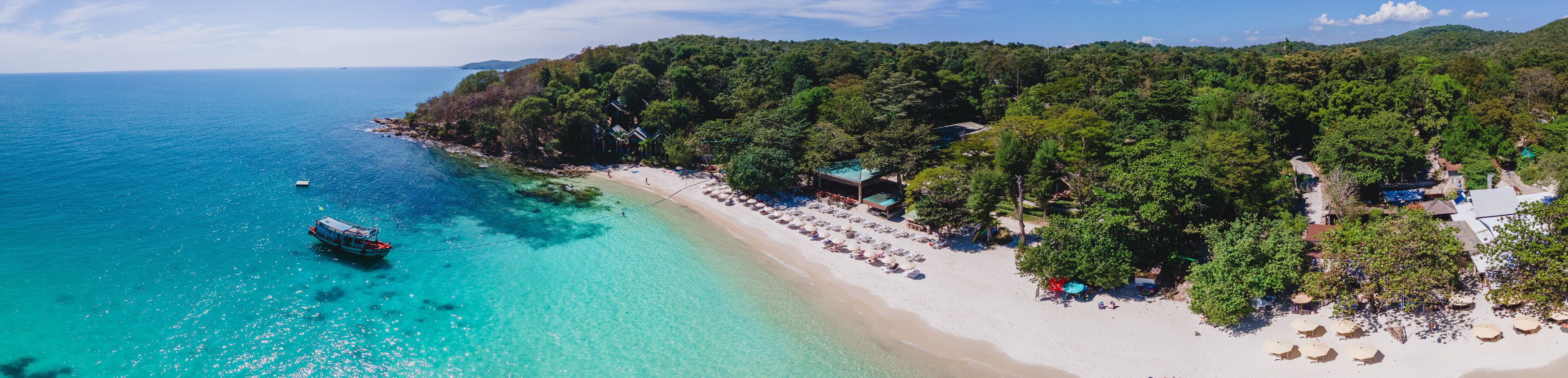 Koh Samet Island Thailand, aerial drone view from above at the Samed Island in Thailand with a turqouse colored ocean and a white tropical beach from above drone view panorama