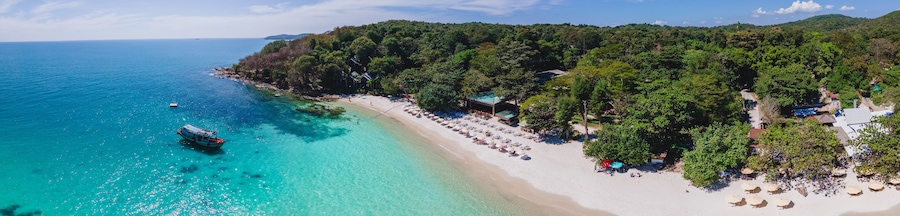 Koh Samet Island Thailand, aerial drone view from above at the Samed Island in Thailand with a turqouse colored ocean and a white tropical beach from above drone view panorama