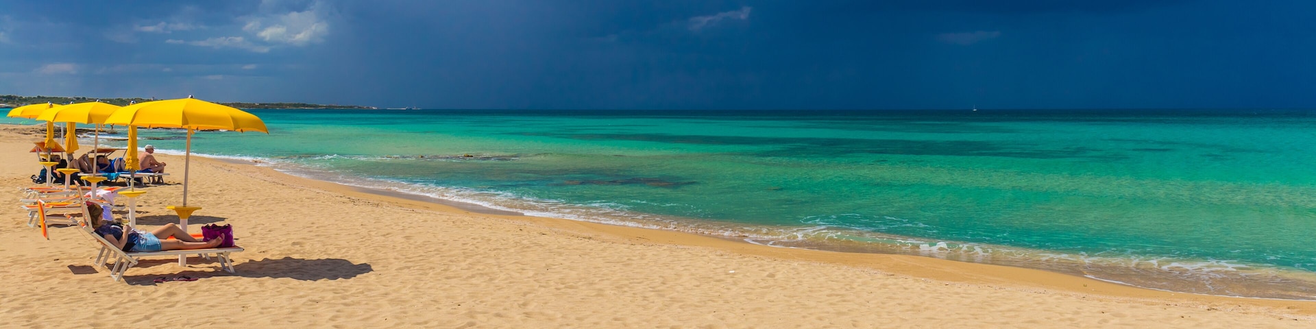 Amazing golden sand beach near Monopolli Capitolo, amazing atmosphere during stormy day, Apulia region, Southern Italy