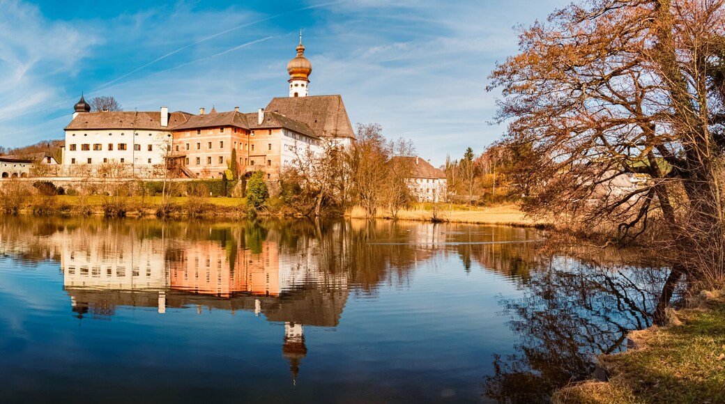 High resolution stitched alpine winter panorama with a monastery and reflections at the famous Lake Hoeglwoerther See, Anger, Berchtesgadener Land, Bavaria, Germany