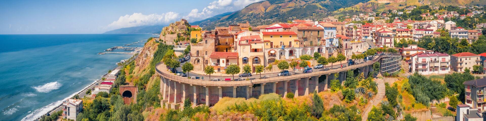 Panoramic summer view from flying drone of San Lucido - town and comune in the province of Cosenza in the Calabria region. Impressive summer scene of Italy, Europe. Traveling concept background.