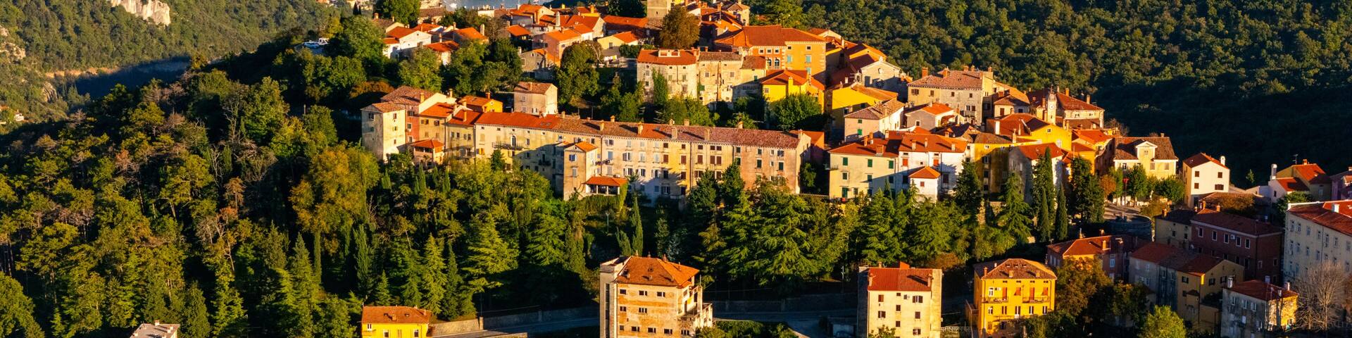Aerial View of Labin Old Town, Croatia – Historic Hilltop City with Red Rooftops, Adriatic Sea View and Wild Mediterranean Landscape