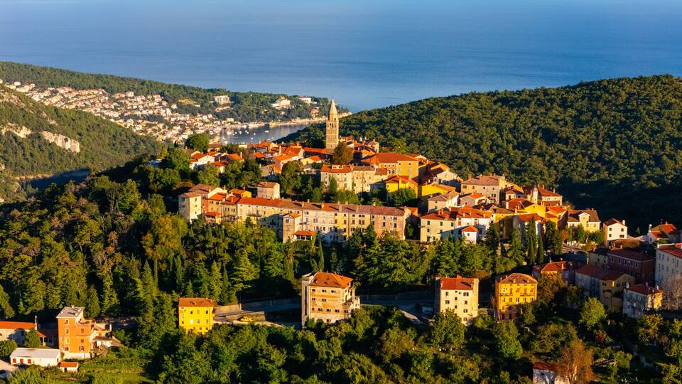 Aerial View of Labin Old Town, Croatia – Historic Hilltop City with Red Rooftops, Adriatic Sea View and Wild Mediterranean Landscape