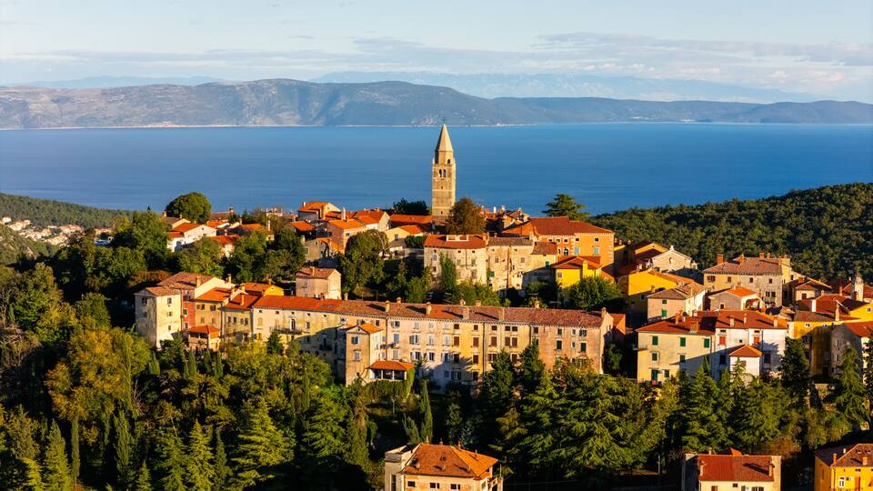 Aerial View of Labin Old Town, Croatia – Historic Hilltop City with Red Rooftops, Adriatic Sea View and Wild Mediterranean Landscape