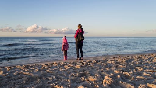 Mother with her doughter on sea beach