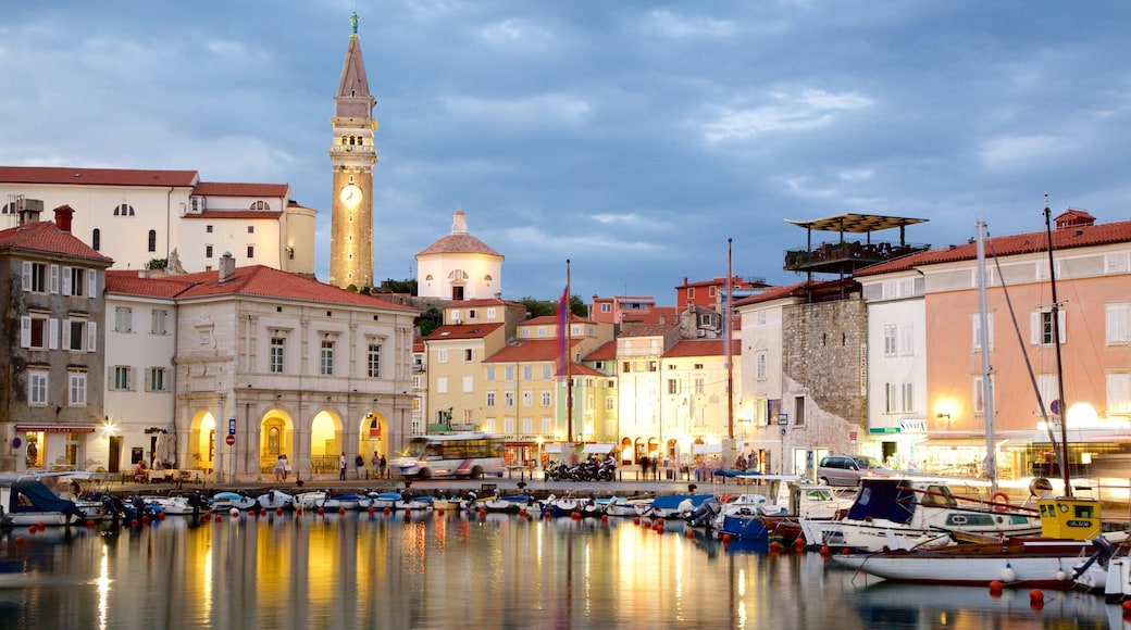 Piran showing a marina, boating and night scenes
