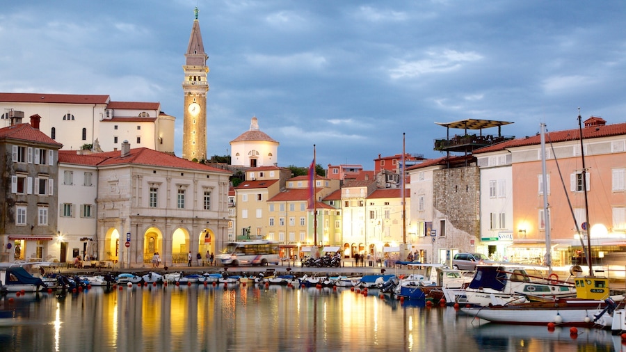 Piran which includes night scenes, boating and a marina