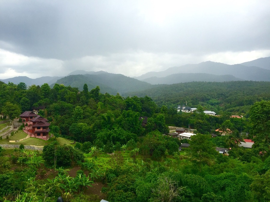 Rain showers over Ban Pong. The spectacular view from "Max Coffee on the Hill" in Chiang Mai.