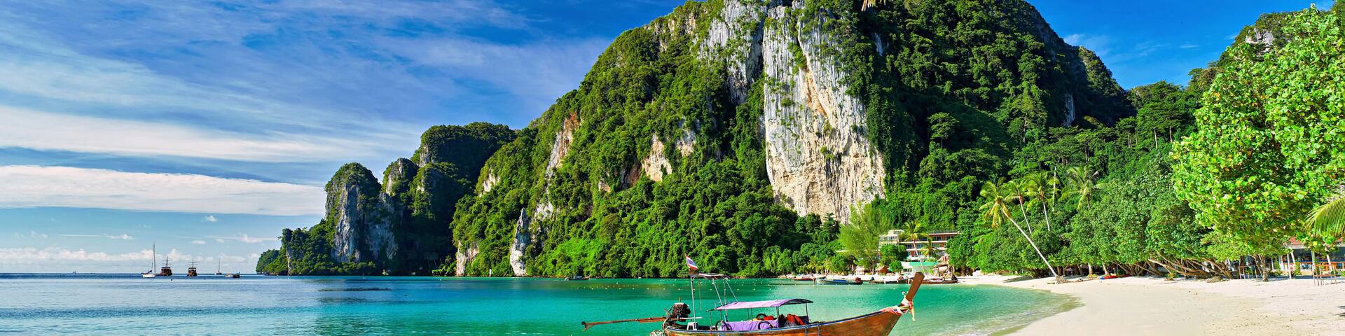 koh phi phi thailand with long tail boat on beach