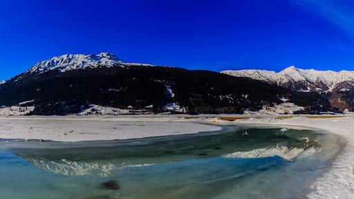 Panorama of the Resia/Reschen Lake adorned with a Romanesque ch