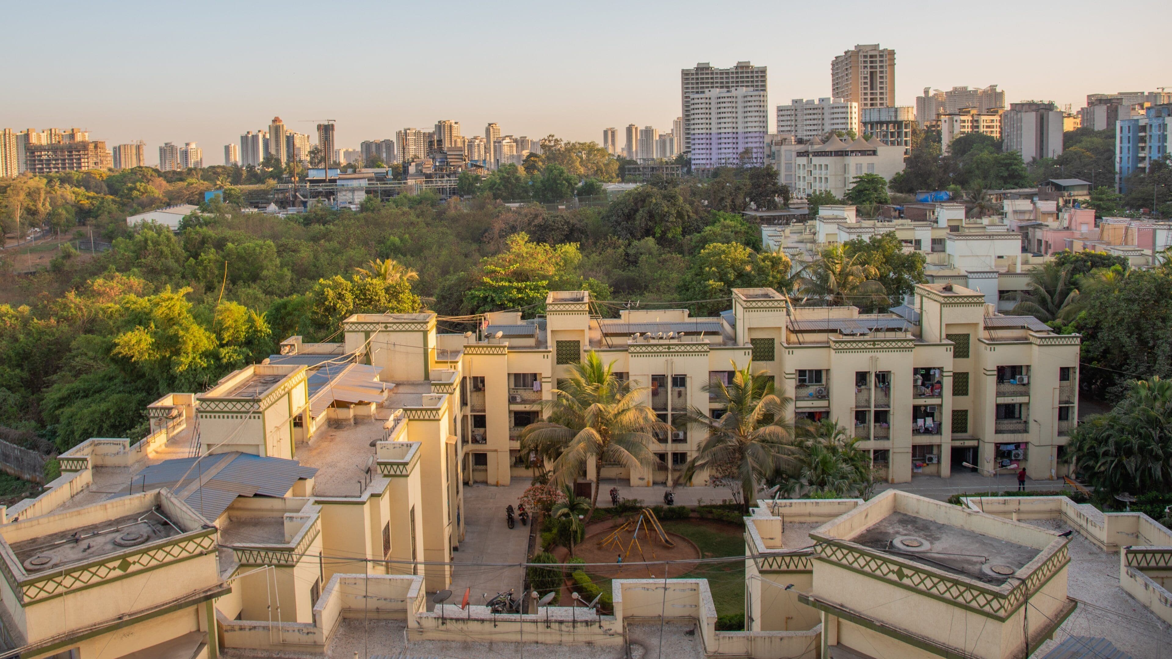 Thane featuring landscape views, a city and a sunset