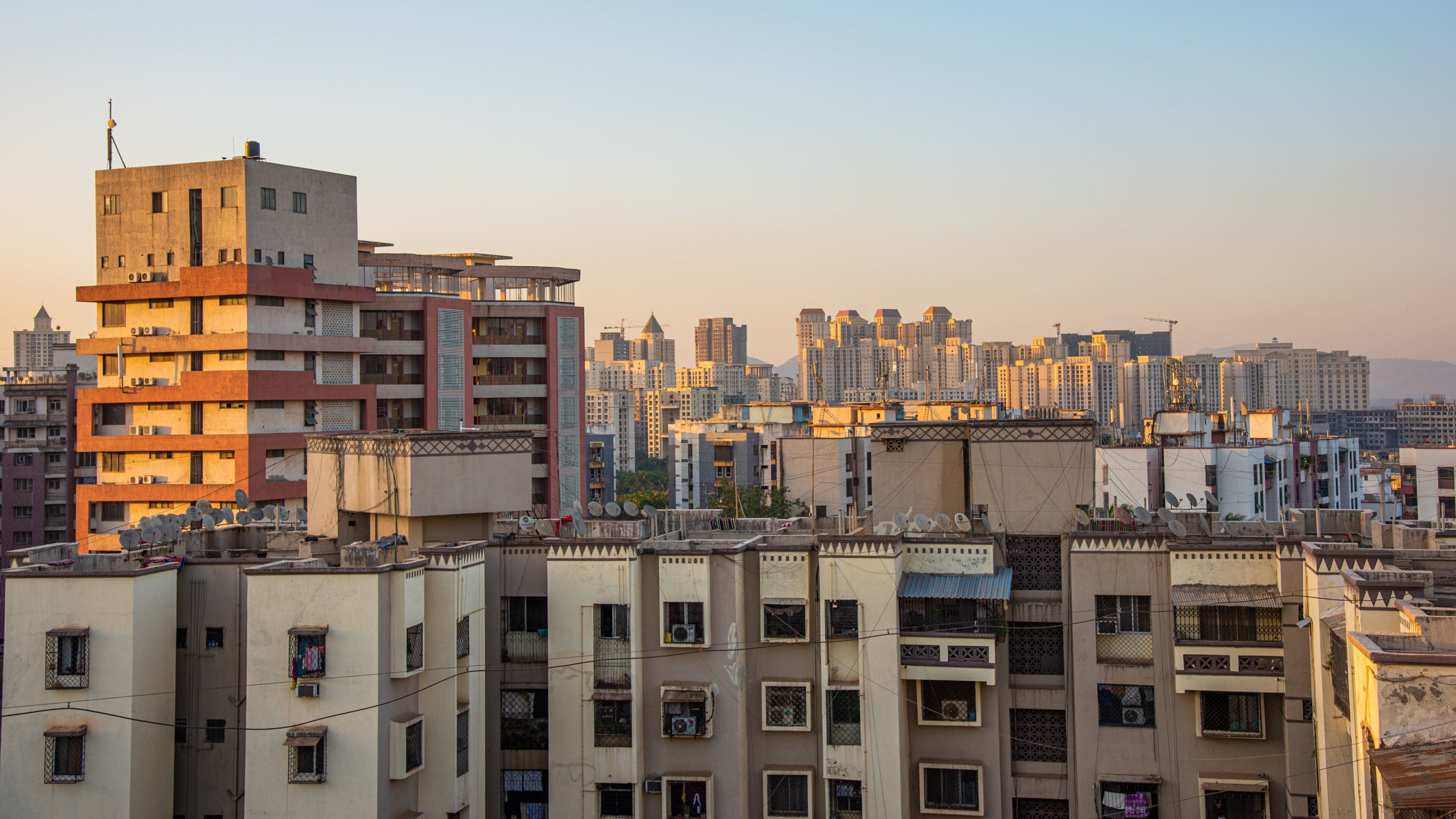 Thane which includes a city and a sunset