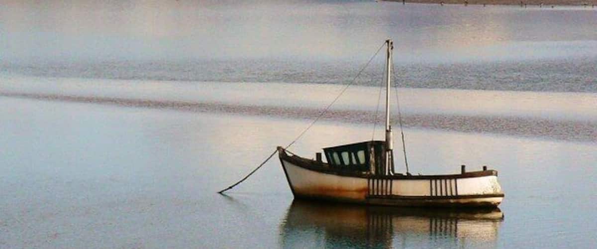 A lonely boat. Facing The Hill (SD1784), Millom, Cumbria UK.