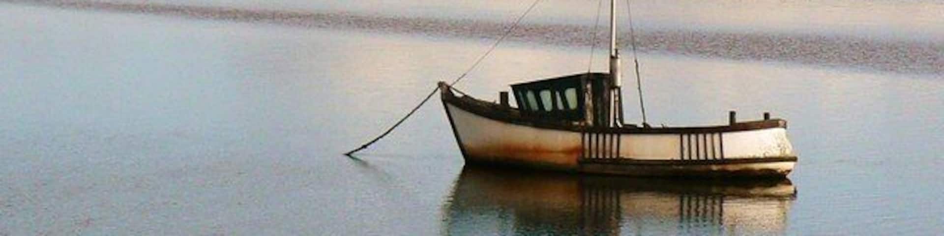 A lonely boat. Facing The Hill (SD1784), Millom, Cumbria UK.