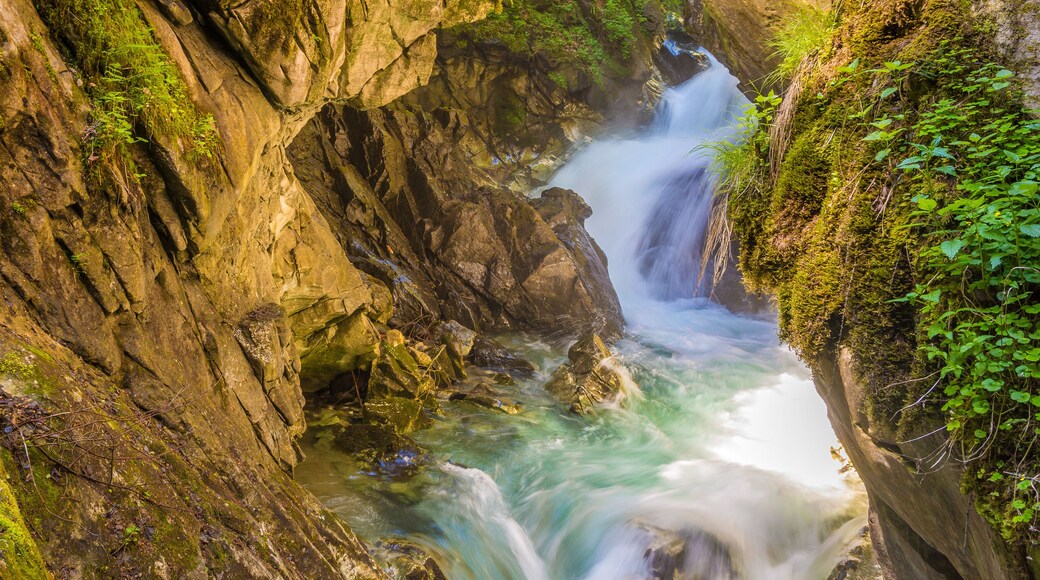 Waterfalls Stanghe (Gilfenklamm) localed near Racines, Bolzano in South Tyrol, Italy. Wooden bridges and runways lead through the canyon and give a spectacular sight to the waterfalls.