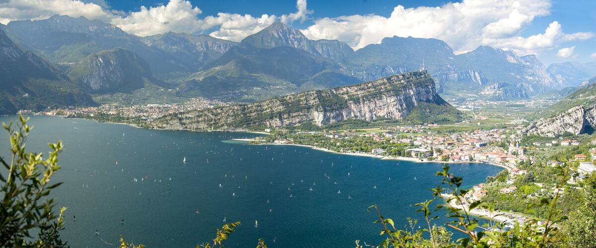 A coastal town with a bay, surrounded by mountains and cliffs.