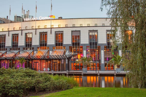 Holland Casino which includes a casino and a river or creek