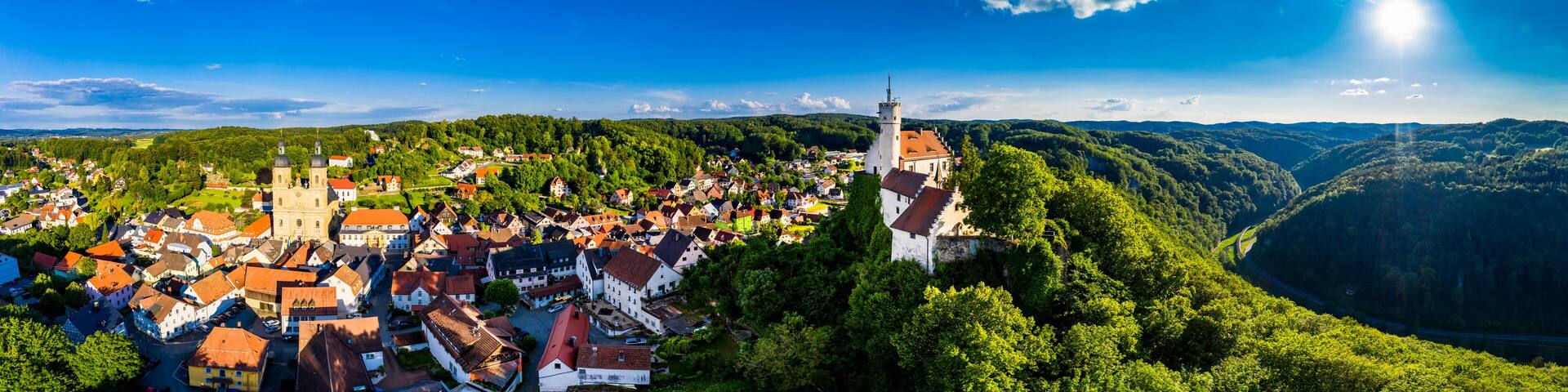 Germany, Bavaria, Gossweinstein, Aerial view of urban landscape with castle and church