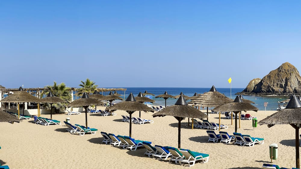 Panorama of white sand beach on the shores of the Indian Ocean in Dibba, Al Fujairah, United Arab Emirates