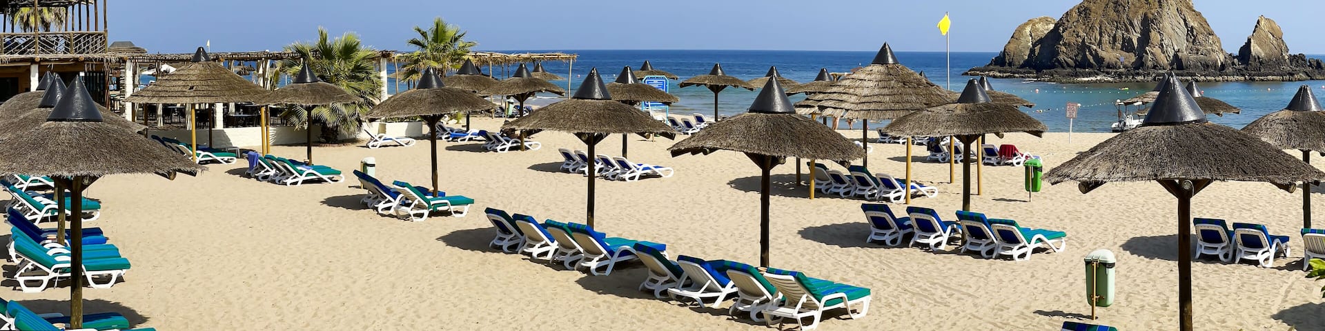 Panorama of white sand beach on the shores of the Indian Ocean in Dibba, Al Fujairah, United Arab Emirates