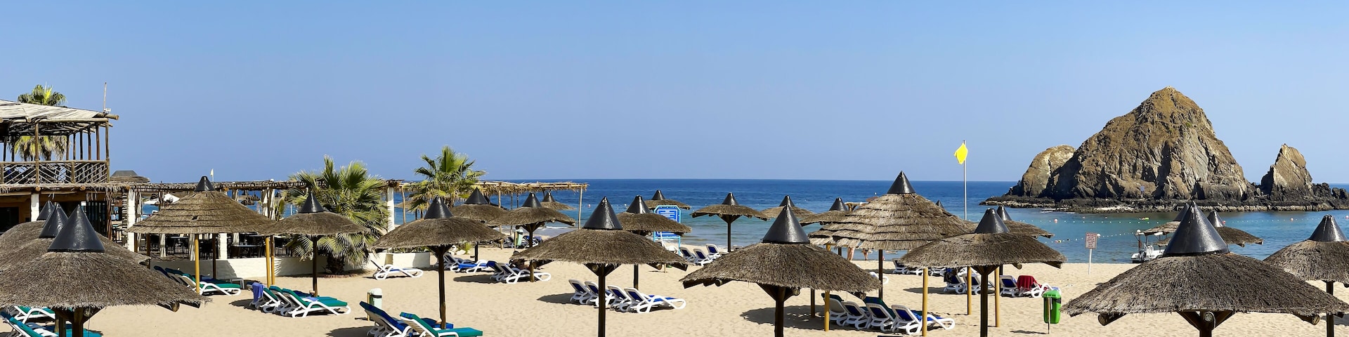 Panorama of white sand beach on the shores of the Indian Ocean in Dibba, Al Fujairah, United Arab Emirates