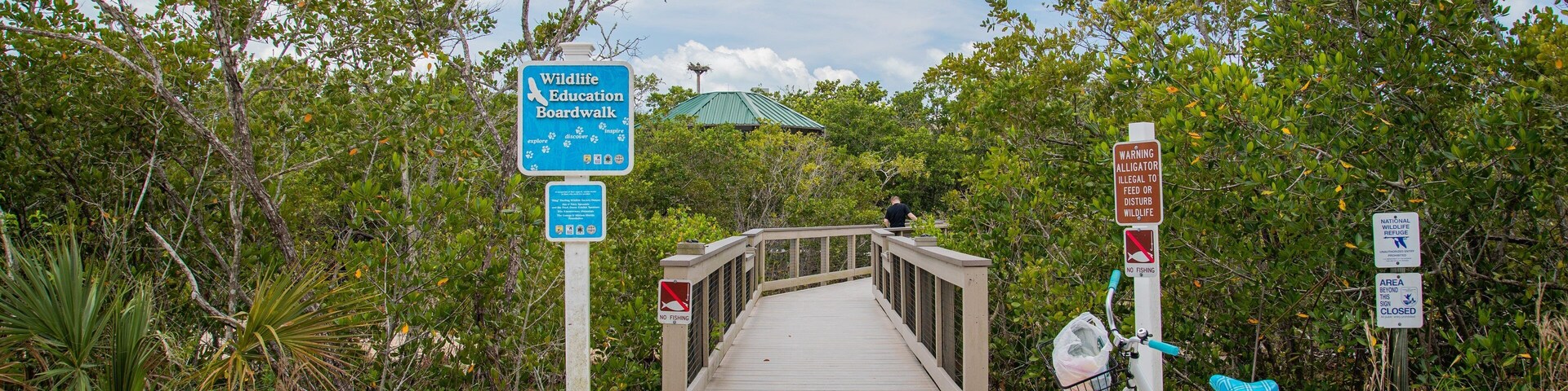 J. N. Ding Darling National Wildlife Refuge showing signage and a bridge