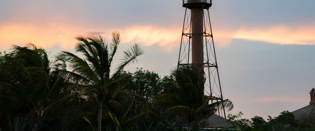 Sanibel Island Lighthouse which includes a sunset and a lighthouse