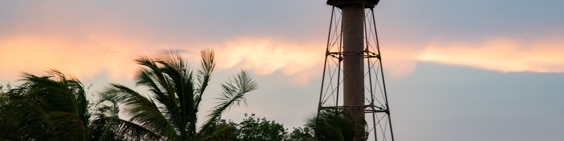 Sanibel Island Lighthouse which includes a sunset and a lighthouse
