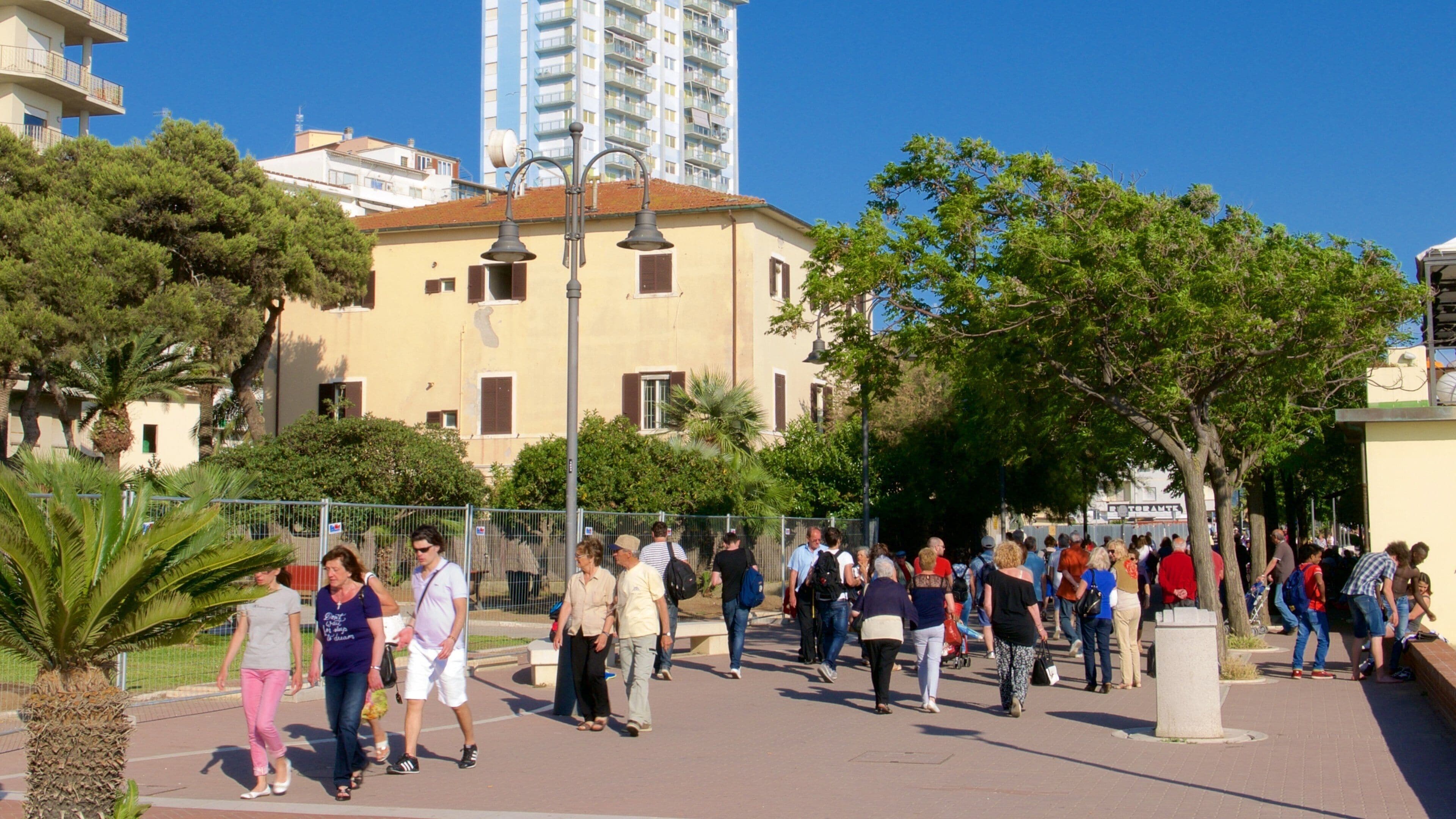 Follonica as well as a large group of people
