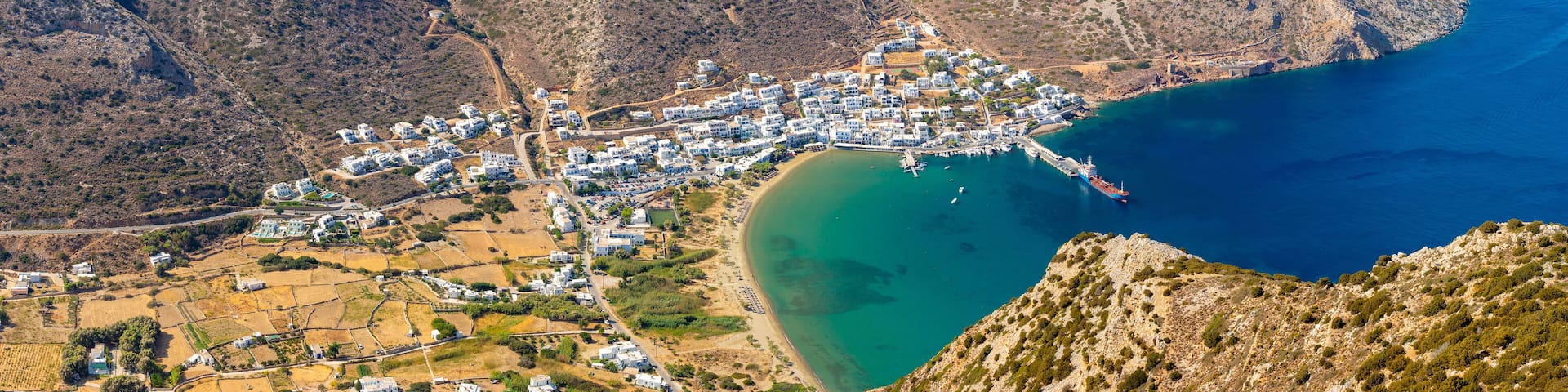 Panoramic view of Sifnos island with the main port of the Kamares. Cyclades, Greece