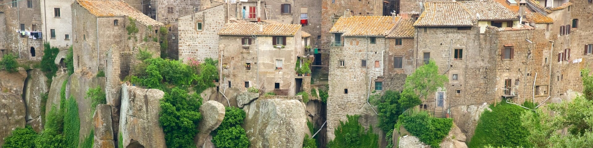 A historic town with stone buildings and lush greenery.