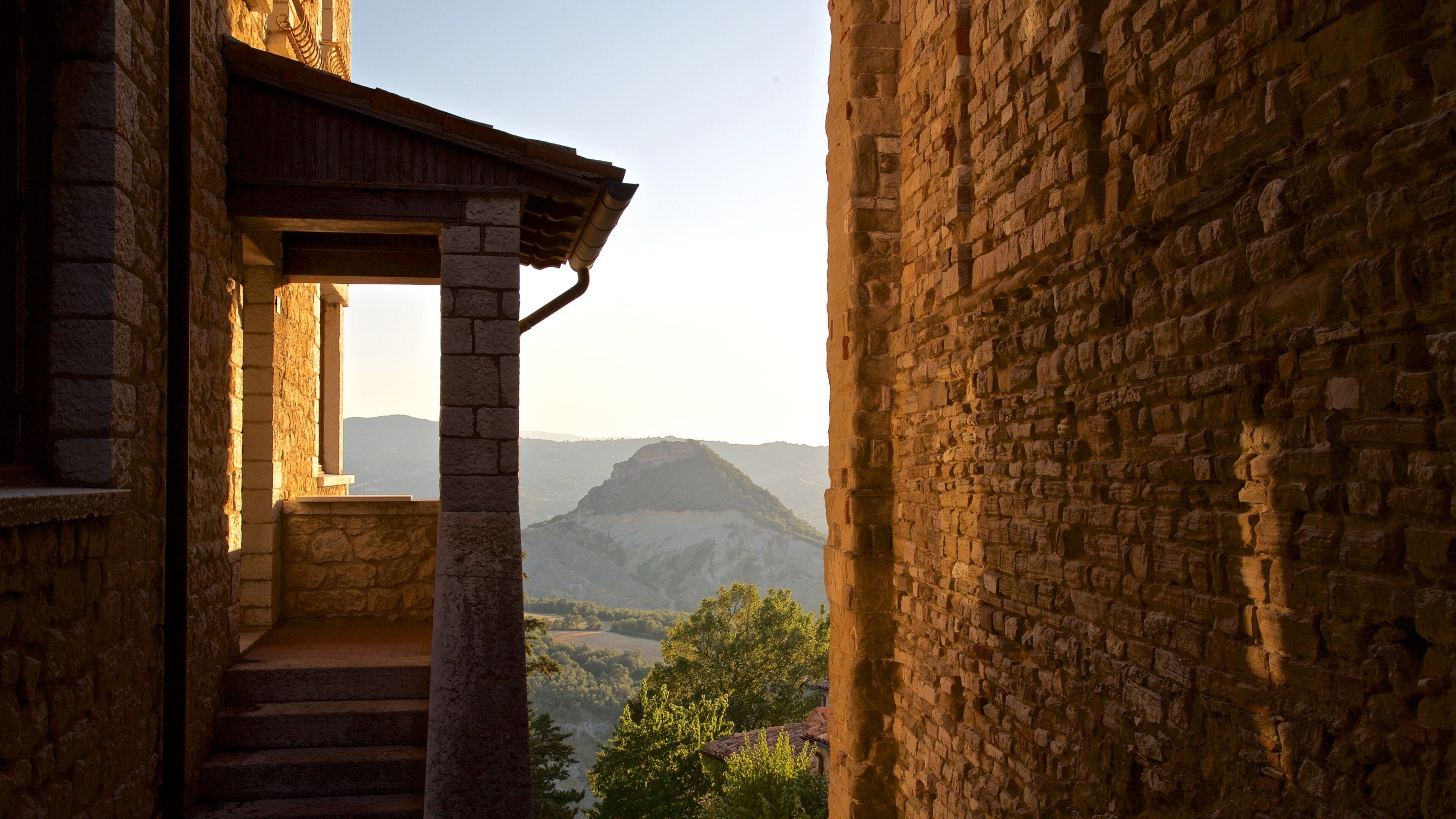 San Leo featuring tranquil scenes and a sunset