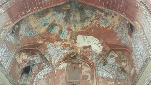 Built in AD 1571, the Jami Mosque at Fatehpur Sikri marks the phase of transition in Islamic art as the indigenous architectural elements were blended with the Persian architecture.
This photograph is of the niche in the wall of the mosque towards which the congregation faces to pray and what is known as the mihrab. Adorned with inlaid mosaic of stones that are bordered by glazed tiles and golden inscriptions on royal blue background, the stunning structure has been taken over by natural elements and several bee hives can be seen arching into walls. #StunningStructures #architecture #natureoverman