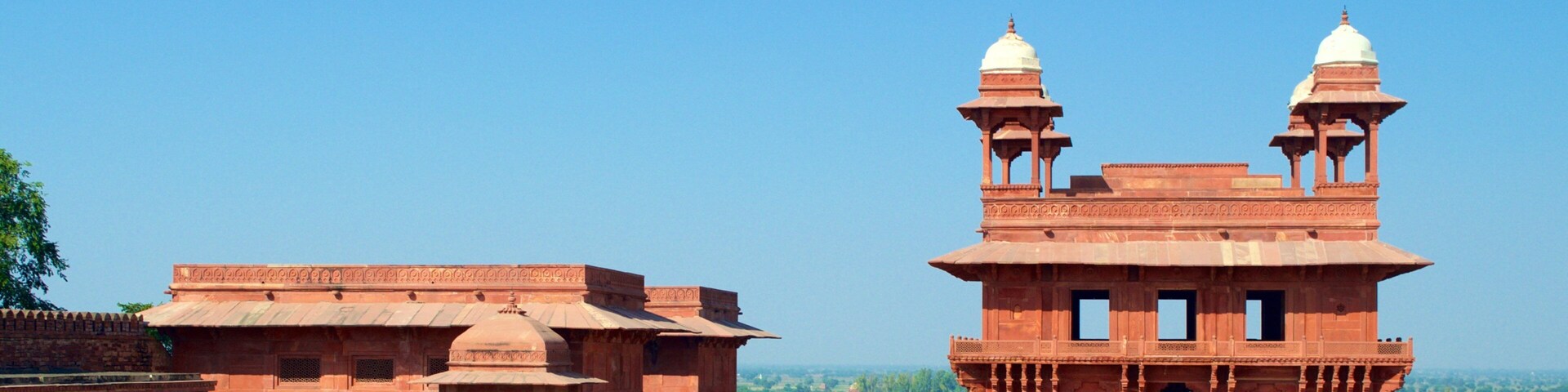 Fatehpur Sikri featuring a temple or place of worship and a square or plaza as well as a large group of people