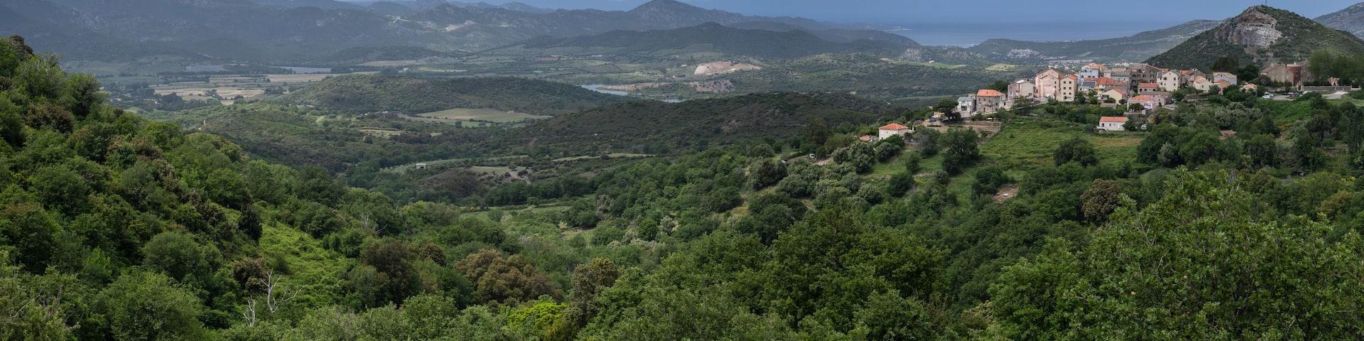 Corsican landscape of hills and the village of Oletta