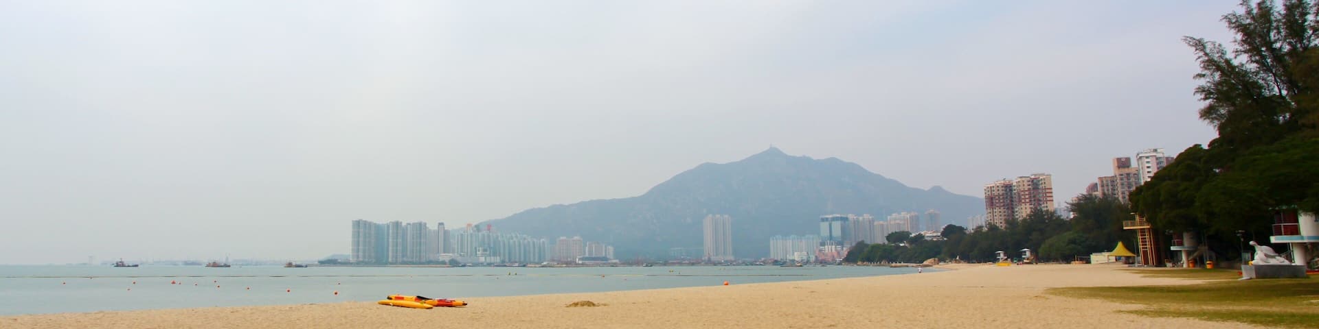 Golden Beach which includes a sandy beach and tropical scenes