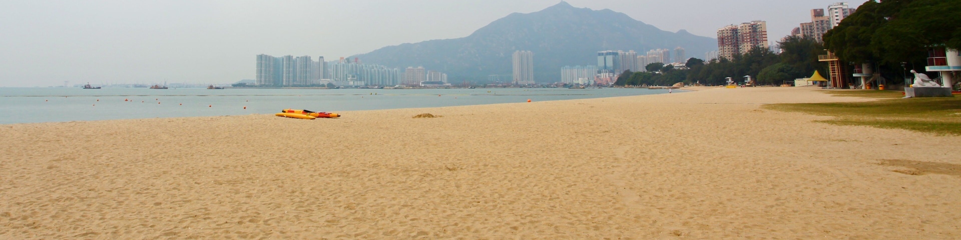 Golden Beach which includes a sandy beach and tropical scenes
