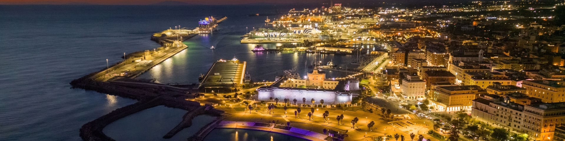 Small Italian town seen from above, sea and cars. Civitavecchia