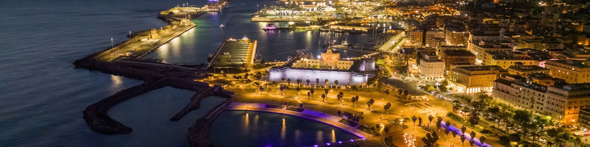 Small Italian town seen from above, sea and cars. Civitavecchia