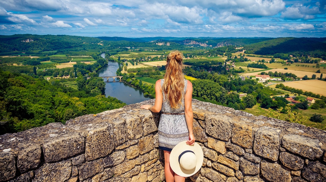 Woman traveling in France-Dordogne river viewpoint of Domme
