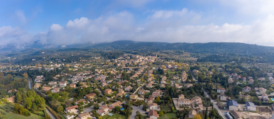 Panoramic aerial view of houses on cloudy day in Lagnes, France