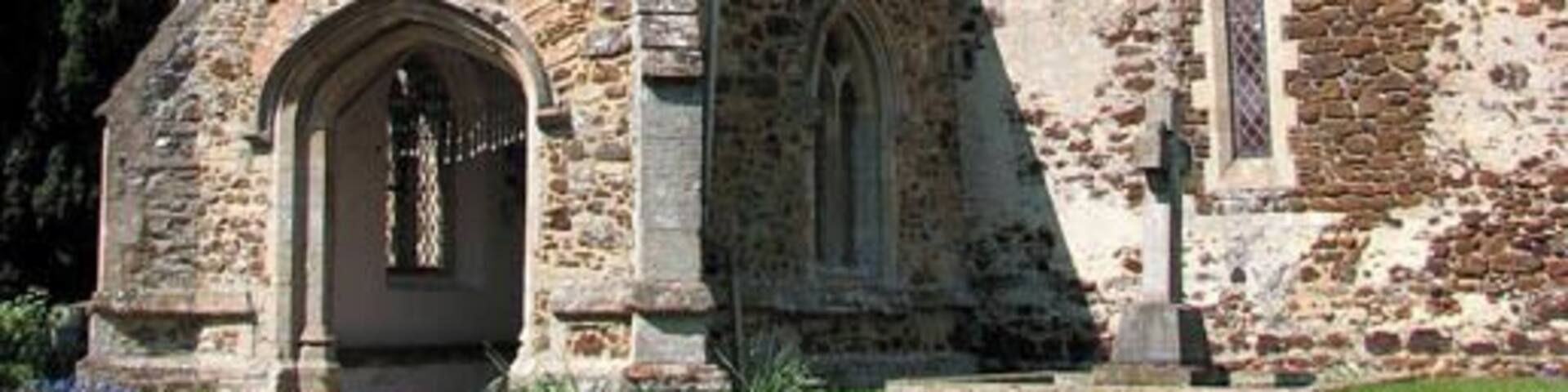 St Mary's church - tower and porch St Mary's is judged by architectural historians to be of Saxon origin. The church is built of carstone and flint and has a round tower with an octagonal top, believed to once have been higher. Interestingly, the tower has no stairs as in very early times ladders were used to access the upper floors which explains the doorways in the east and west walls. An archway of Saxon construction links the tower to the nave. The font dates from the 14th century. There are two Saxon windows in the north and south walls. During the 19th century the windows were changed - a lancet window was being put in the north wall and on the south side two early English and Perpendicular windows were blocked up and another lancet window was added where there had been an early English window. The church was restored and the floor was retiled during Victorian times.