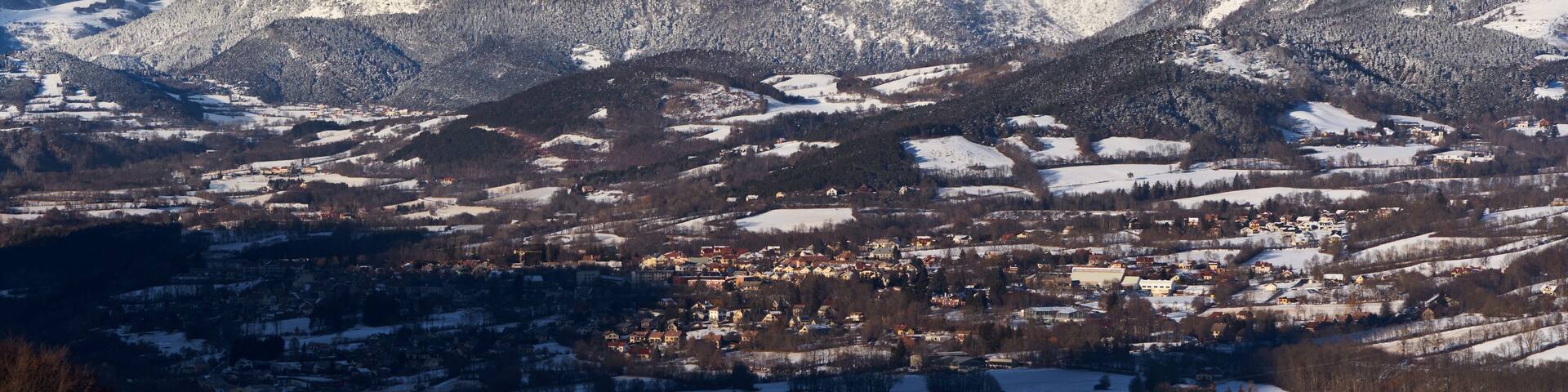 The village of Saint-Bonnet-en-Champsaur and the Petit Chaillol mountain peak in winter. Drac Valley, Hautes-Alpes, French Alps, France
