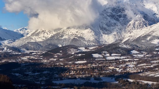 The village of Saint-Bonnet-en-Champsaur and the Petit Chaillol mountain peak in winter. Drac Valley, Hautes-Alpes, French Alps, France