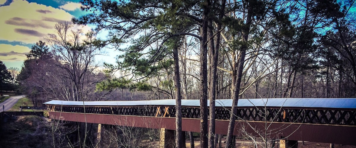This 270 ft covered bridge was built in 1921 and the only remaining bridge of it's kind in Cullman County. It was used mainly by farmers. It spans the Crooked Creek, site of Civil War Skirmishes under Nathan Bedford Forrest. Many relics have been found around this creek and can be viewed at the museum just down the road. This bridge is open to foot traffic and also offers picnic areas and walking trails. An old water mill is located on the property too. #roadtrip
