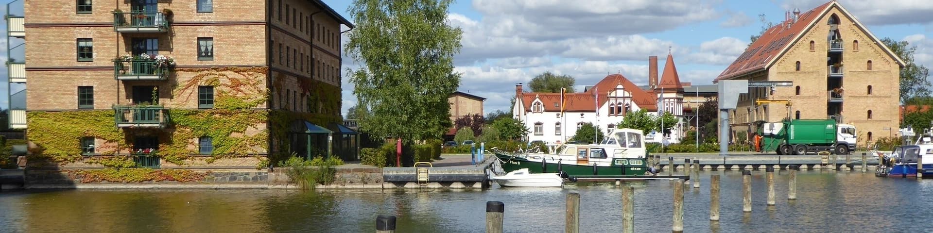 Historical warehouses converted into residential buildings at the city harbor of Neustrelitz, Mecklenburg-Western Pomerania, Germany