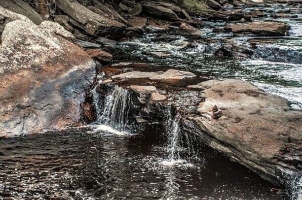 A section of the Natchaug River with a series of small falls and cascades. Here the water has carved out some fantastic pools. The largest being named Diana's pool.