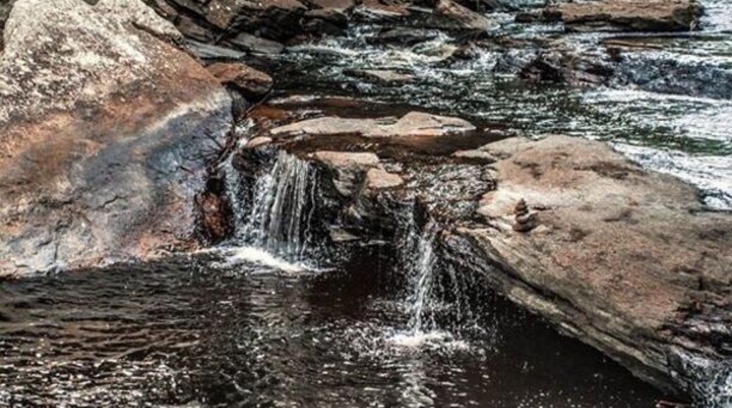 A section of the Natchaug River with a series of small falls and cascades. Here the water has carved out some fantastic pools. The largest being named Diana's pool.
