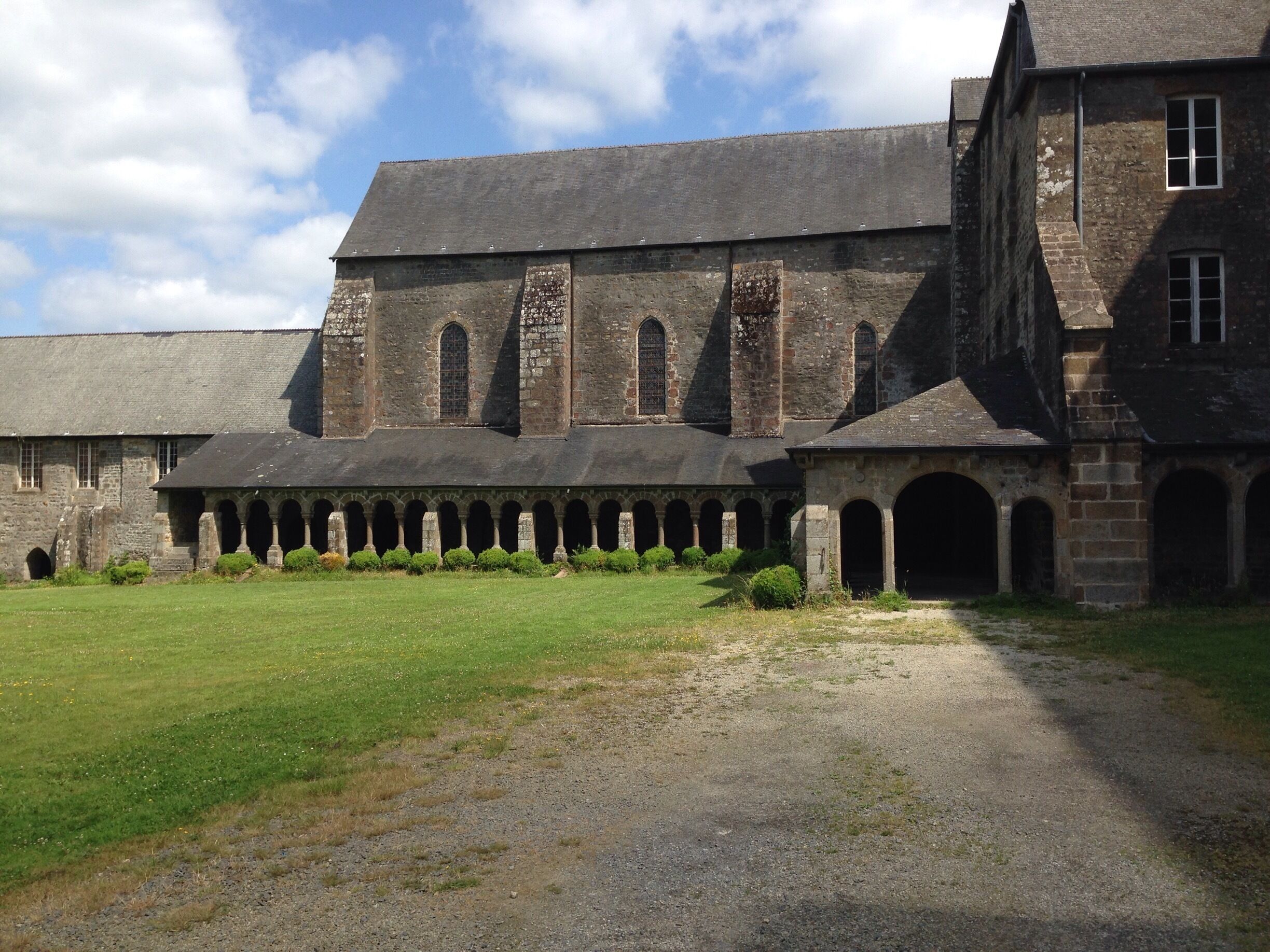 A historic building with a large courtyard and arched walkways.